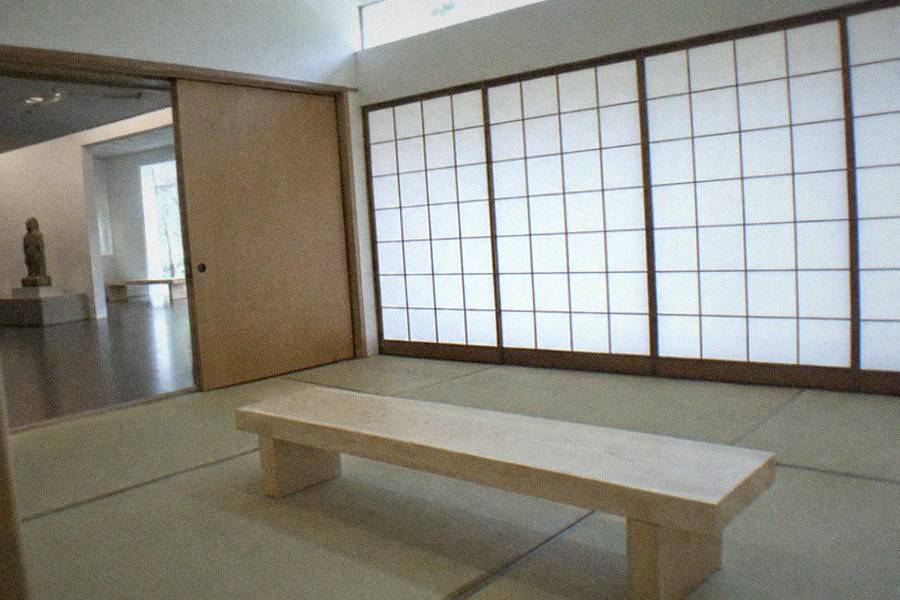 A hands-on workshop counter where visitors decorate empty noodle cups with markers