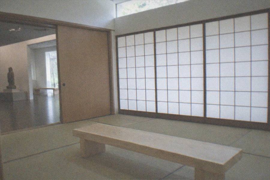 Ticket counter with a visitor buying a museum admission ticket